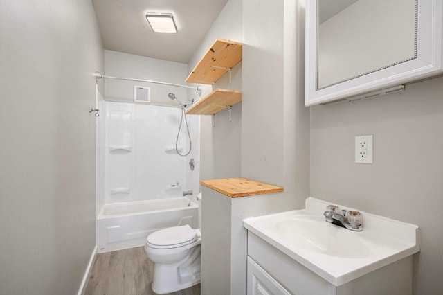 857 Oakdale Ave, Saint Paul, MN 55107 - full bath featuring wood finished floors, vanity, toilet, bathing tub / shower combination, and baseboards