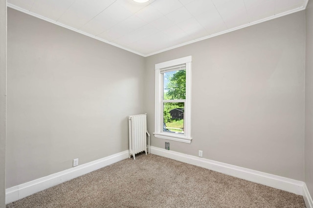857 Oakdale Ave, Saint Paul, MN 55107 - spare room with radiator heating unit, carpet flooring, baseboards, and crown molding