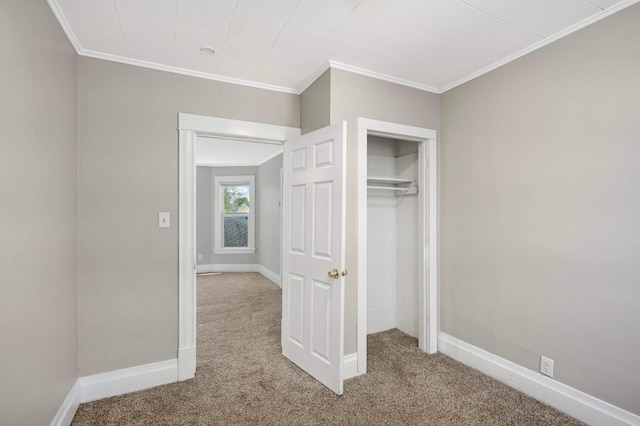 857 Oakdale Ave, Saint Paul, MN 55107 - unfurnished bedroom with carpet floors, ornamental molding, baseboards, and a closet