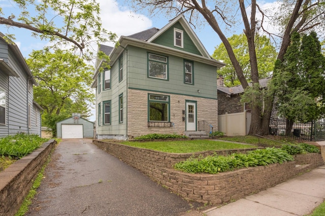 857 Oakdale Ave, Saint Paul, MN 55107 - american foursquare style home with driveway, a garage, and an outbuilding