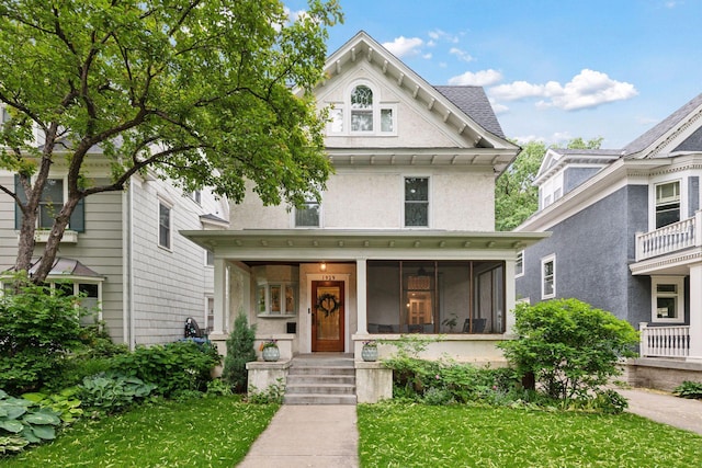 1929 Humboldt Ave S, Minneapolis, MN 55403 - view of front of property featuring a front yard, a porch, and stucco siding