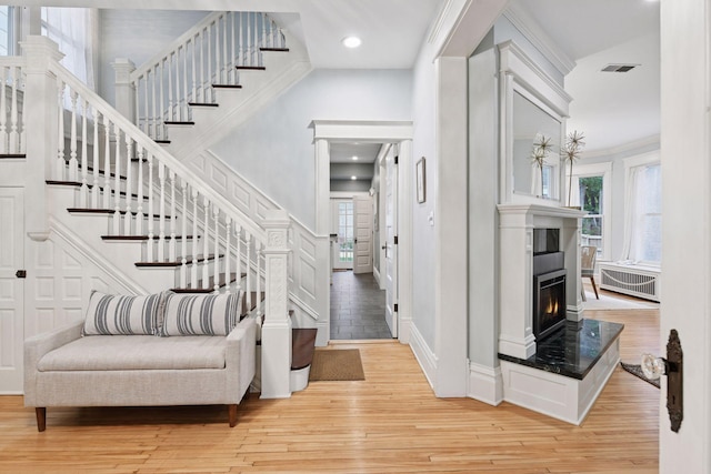 1929 Humboldt Ave S, Minneapolis, MN 55403 - entryway featuring plenty of natural light, light wood-style floors, stairs, a glass covered fireplace, and recessed lighting