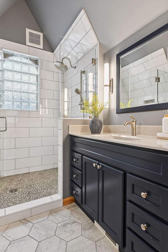 1929 Humboldt Ave S, Minneapolis, MN 55403 - bathroom featuring a shower stall, vanity, and lofted ceiling