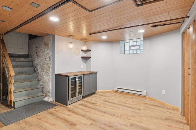 1929 Humboldt Ave S, Minneapolis, MN 55403 - below grade area with a baseboard heating unit, beverage cooler, wooden ceiling, bar, and light wood-style floors