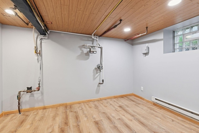 1929 Humboldt Ave S, Minneapolis, MN 55403 - below grade area featuring a baseboard heating unit, wood finished floors, wooden ceiling, recessed lighting, and baseboards