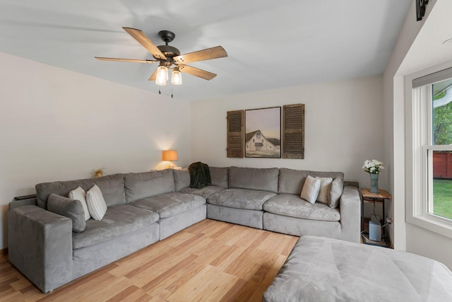 713 9th St NW, Buffalo, MN 55313 - living area with wood finished floors, plenty of natural light, and a ceiling fan