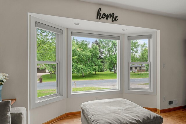 713 9th St NW, Buffalo, MN 55313 - bedroom featuring baseboards and light wood-style flooring