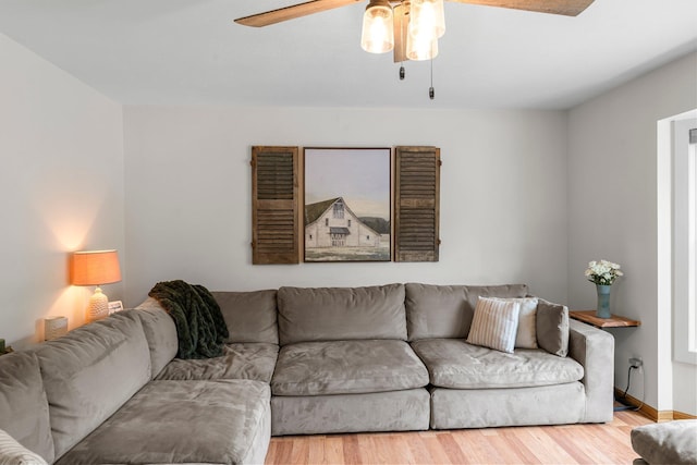 713 9th St NW, Buffalo, MN 55313 - living room featuring ceiling fan, wood finished floors, and baseboards