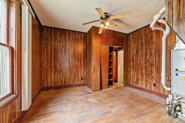 909 14th St S, Benson, MN 56215 - empty room featuring wood walls, a ceiling fan, wood-type flooring, baseboards, and wooden ceiling