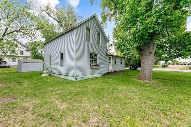 909 14th St S, Benson, MN 56215 - view of home's exterior with a chimney and a lawn