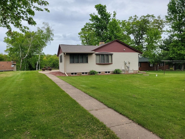 109 155th Ave, Beaver Twp, WI 54889 - view of front of house with a front yard, a chimney, and a shingled roof