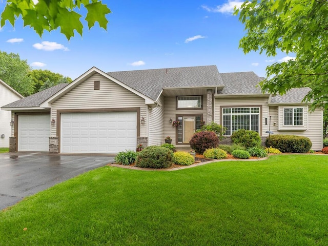 4901 193rd St W, Farmington, MN 55024 - view of front facade with asphalt driveway, a garage, roof with shingles, and a front yard