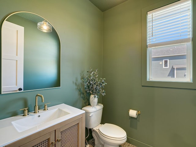 15441 110th Ave N, Dayton, MN 55369 - bathroom with toilet, vanity, and baseboards