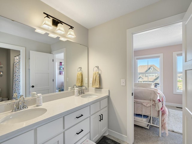 15441 110th Ave N, Dayton, MN 55369 - bathroom with double vanity, connected bathroom, baseboards, and toilet