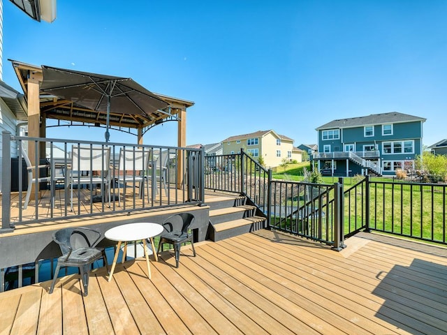 15441 110th Ave N, Dayton, MN 55369 - wooden deck featuring stairs, a residential view, a gazebo, and a lawn