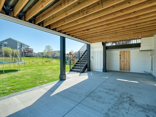 15441 110th Ave N, Dayton, MN 55369 - view of patio featuring a trampoline, stairway, a residential view, and a carport