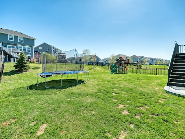 15441 110th Ave N, Dayton, MN 55369 - view of yard featuring a trampoline, a playground, a residential view, and stairway
