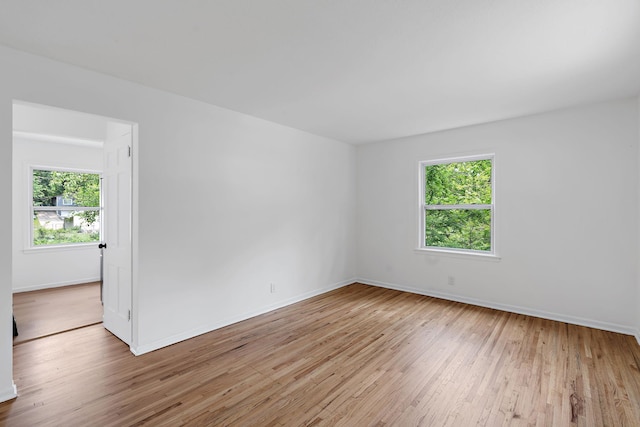 549 Annapolis St E, Saint Paul, MN 55118 - empty room with healthy amount of natural light, wood-type flooring, and baseboards
