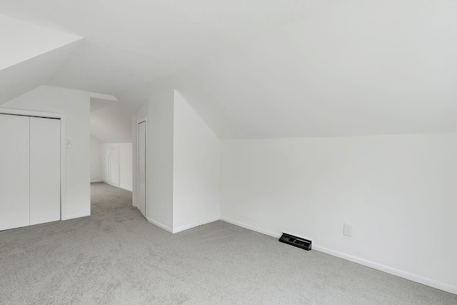 549 Annapolis St E, Saint Paul, MN 55118 - additional living space with carpet floors, vaulted ceiling, and baseboards