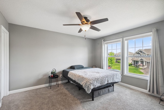4847 Ashton Curv, Woodbury, MN 55129 - bedroom featuring a textured ceiling, light colored carpet, baseboards, and ceiling fan