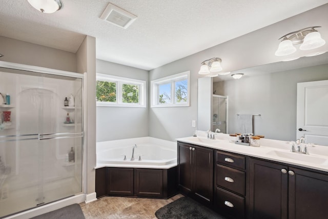 4847 Ashton Curv, Woodbury, MN 55129 - bathroom with a shower stall, a bath, double vanity, and a textured ceiling