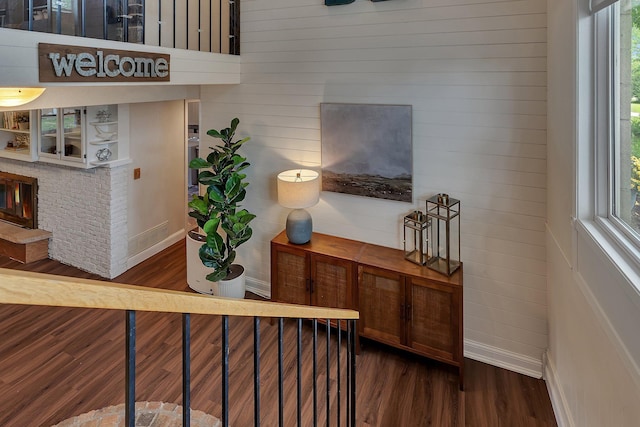 1276 13th Ave N, Saint Cloud, MN 56303 - stairway with wood finished floors, baseboards, and wooden walls