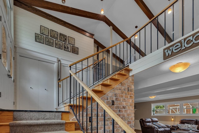 1276 13th Ave N, Saint Cloud, MN 56303 - stairway featuring wood finished floors and a high ceiling