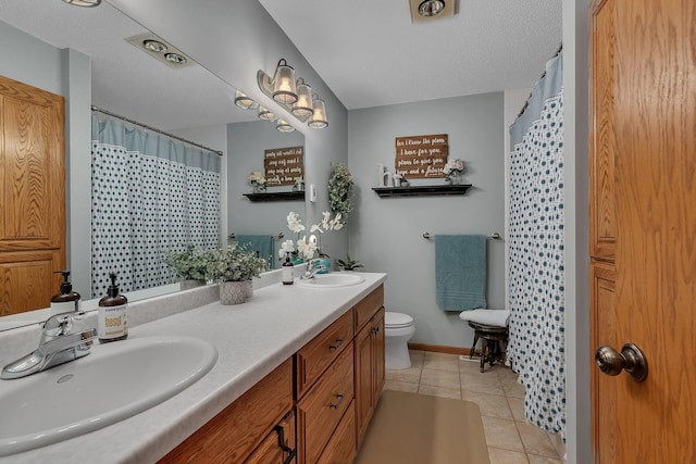 1276 13th Ave N, Saint Cloud, MN 56303 - bathroom featuring tile patterned floors, double vanity, toilet, curtained shower, and a textured ceiling