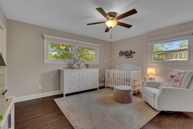 1276 13th Ave N, Saint Cloud, MN 56303 - bedroom featuring dark wood-type flooring, multiple windows, and baseboards