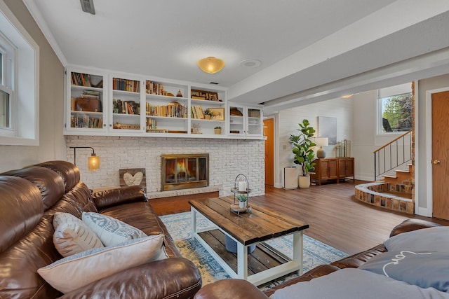 1276 13th Ave N, Saint Cloud, MN 56303 - living area featuring wood finished floors, stairway, and baseboards