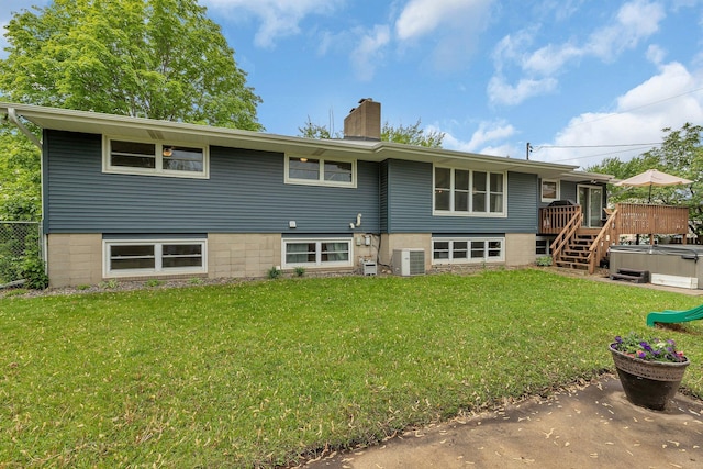 1276 13th Ave N, Saint Cloud, MN 56303 - back of property featuring a hot tub, a deck, central AC, a chimney, and stairs