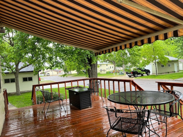 813 11th St N, Benson, MN 56215 - deck with outdoor dining space and a yard