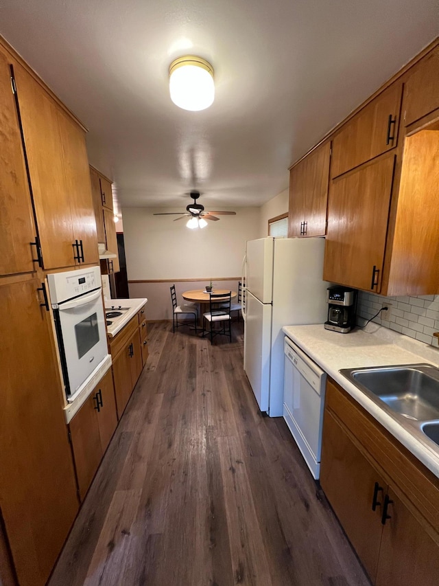 813 11th St N, Benson, MN 56215 - kitchen featuring white appliances, brown cabinetry, ceiling fan, and light countertops
