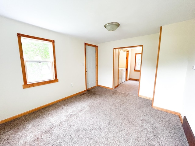 216 Main Ave S, New York Mills, MN 56567 - unfurnished room with light carpet, baseboards, and washer / clothes dryer