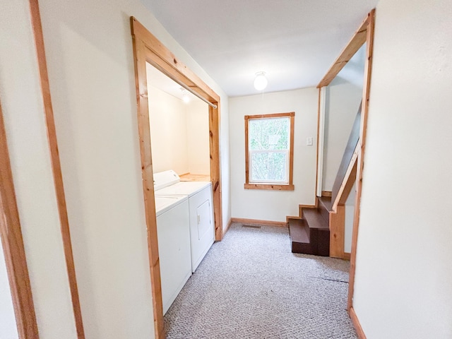 216 Main Ave S, New York Mills, MN 56567 - laundry room featuring washer and dryer, light colored carpet, and baseboards