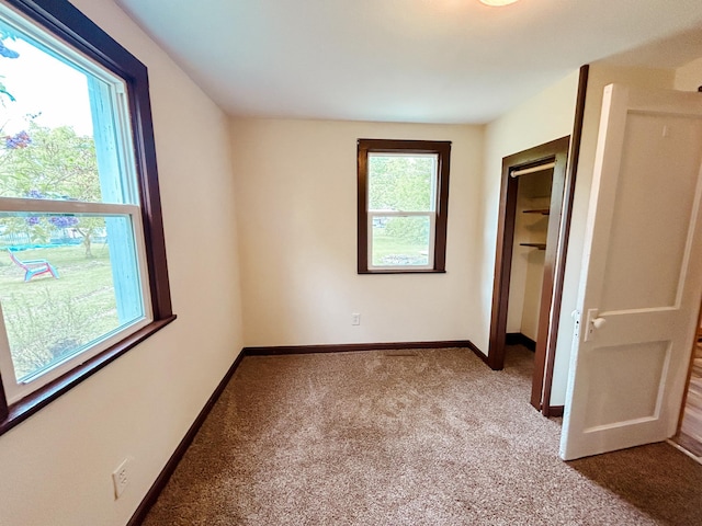 216 Main Ave S, New York Mills, MN 56567 - unfurnished bedroom featuring carpet flooring, baseboards, and a closet