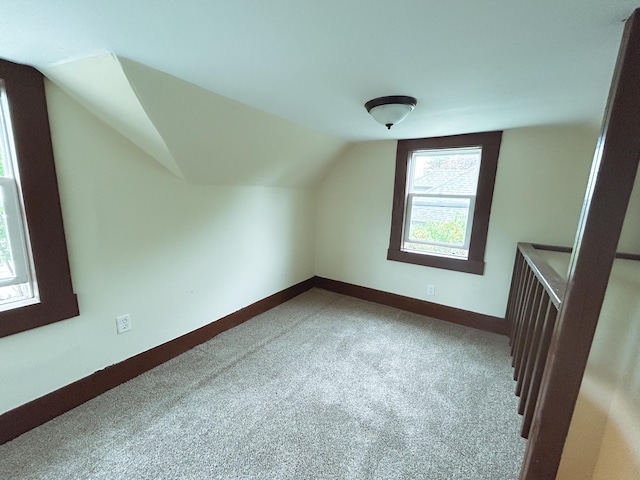 216 Main Ave S, New York Mills, MN 56567 - bonus room featuring carpet, vaulted ceiling, and baseboards