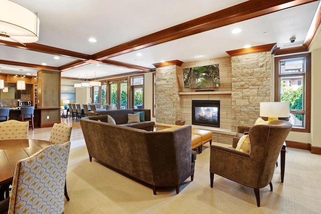 875 Lake St N Unit 315, Wayzata, MN 55391 - living area with beamed ceiling, healthy amount of natural light, a stone fireplace, baseboards, and recessed lighting