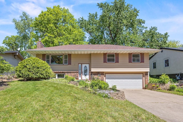 2445 Indian Way N, Saint Paul, MN 55109 - raised ranch featuring a garage, brick siding, driveway, a chimney, and a front yard