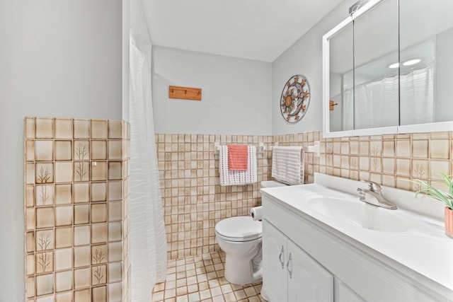 2445 Indian Way N, Saint Paul, MN 55109 - bathroom featuring tile walls, toilet, vanity, tile patterned flooring, and curtained shower