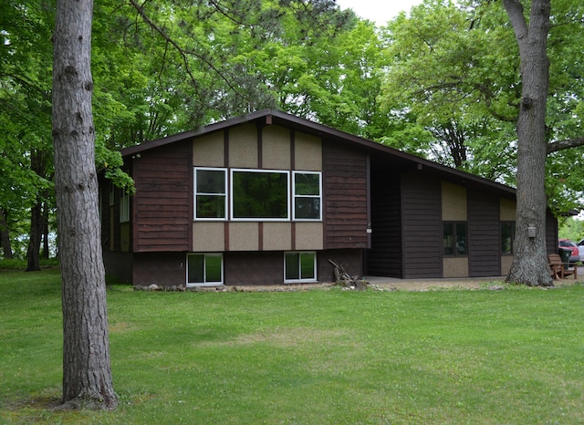 145 Blanding Woods Rd, Saint Croix Falls, WI 54024 - back of house featuring a yard