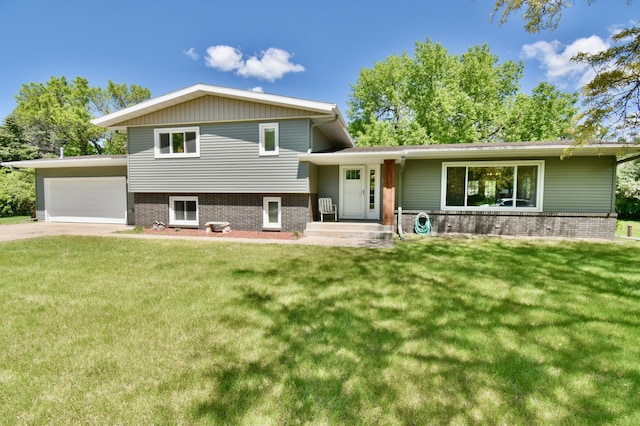 5851 Fairway Ln, Saint Cloud, MN 56303 - tri-level home with a front yard, brick siding, and driveway