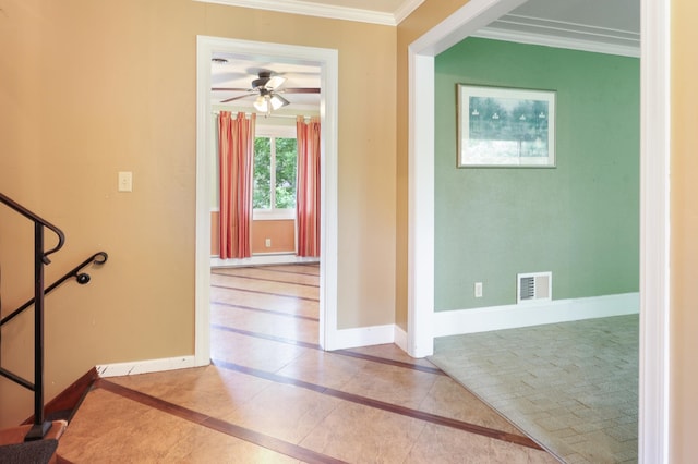5851 Fairway Ln, Saint Cloud, MN 56303 - foyer featuring crown molding, ceiling fan, and inlaid floor details