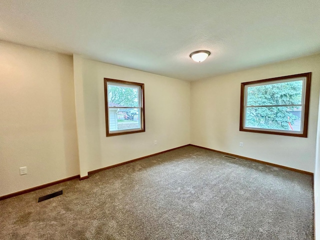 8212 15th Ave S, Bloomington, MN 55425 - carpeted spare room with baseboards
