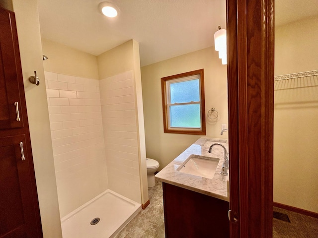 8212 15th Ave S, Bloomington, MN 55425 - full bathroom featuring a shower stall, double vanity, toilet, and baseboards