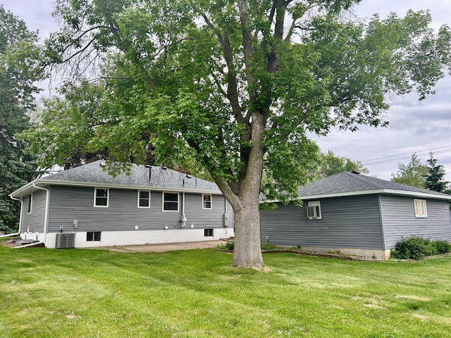 8212 15th Ave S, Bloomington, MN 55425 - back of property featuring a yard, cooling unit, and roof with shingles