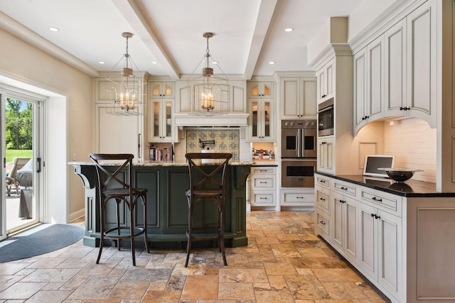1150 Wyndmere Rd, Orono, MN 55391 - kitchen featuring stainless steel double oven, stone tile flooring, backsplash, a kitchen bar, and recessed lighting
