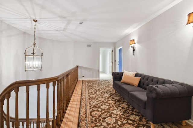 1150 Wyndmere Rd, Orono, MN 55391 - hall featuring an upstairs landing, a chandelier, and wood finished floors