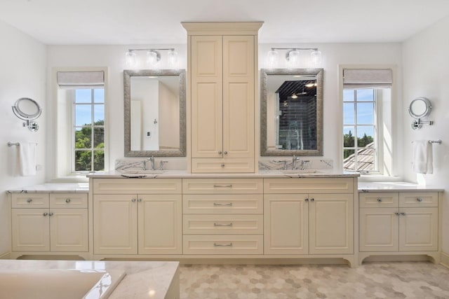 1150 Wyndmere Rd, Orono, MN 55391 - bathroom featuring double vanity and plenty of natural light