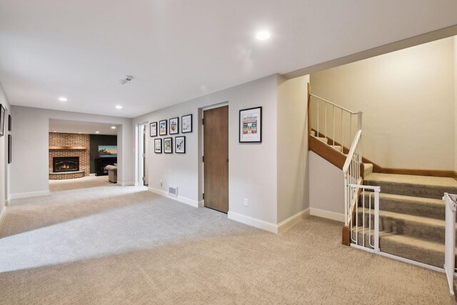 1150 Wyndmere Rd, Orono, MN 55391 - unfurnished living room with carpet floors, stairs, baseboards, recessed lighting, and a fireplace